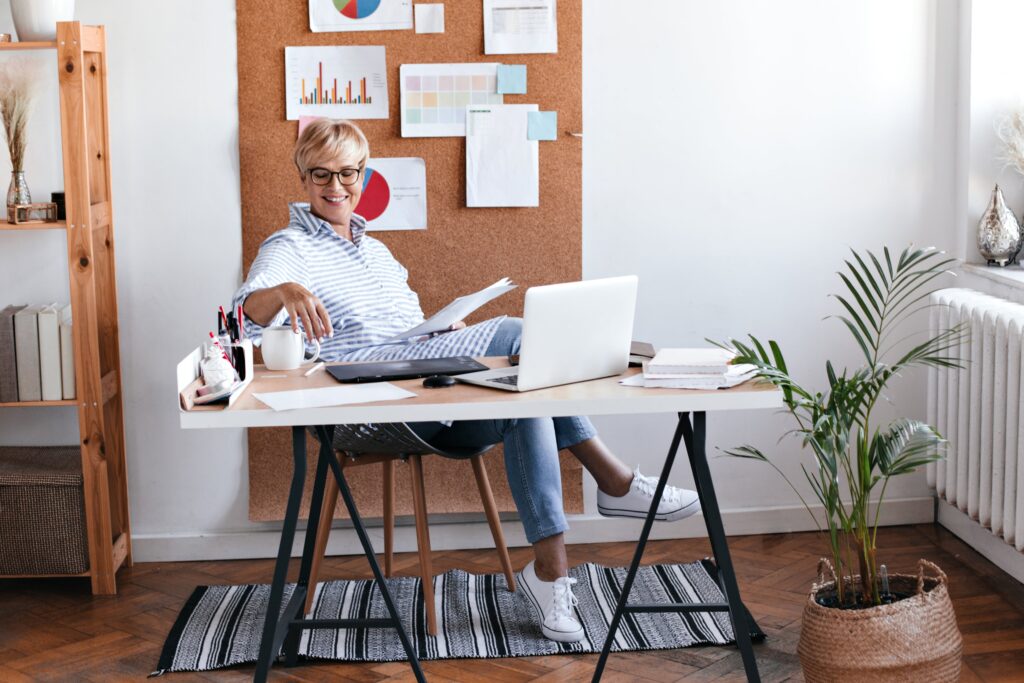 charming lady blue outfit sitting office enjoying coffee min